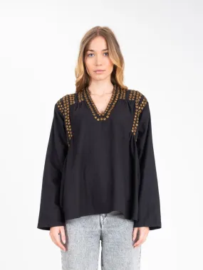 Blouse noire ornée de sequins dorés BLING